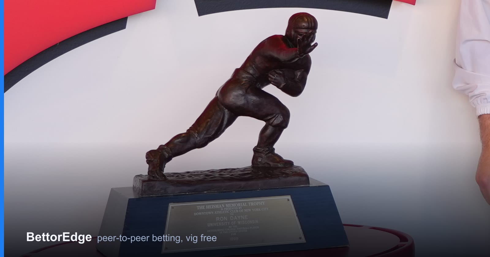 The Heisman Trophy statuette on its pedestal, the award college football futures markets price all season