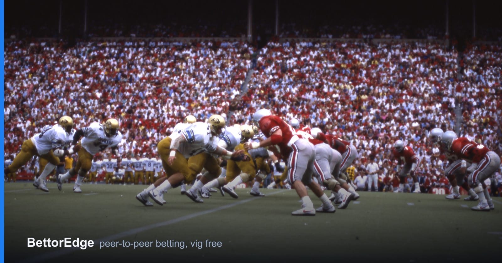 A packed college football stadium behind the line of scrimmage, the crowd that home field advantage is priced on