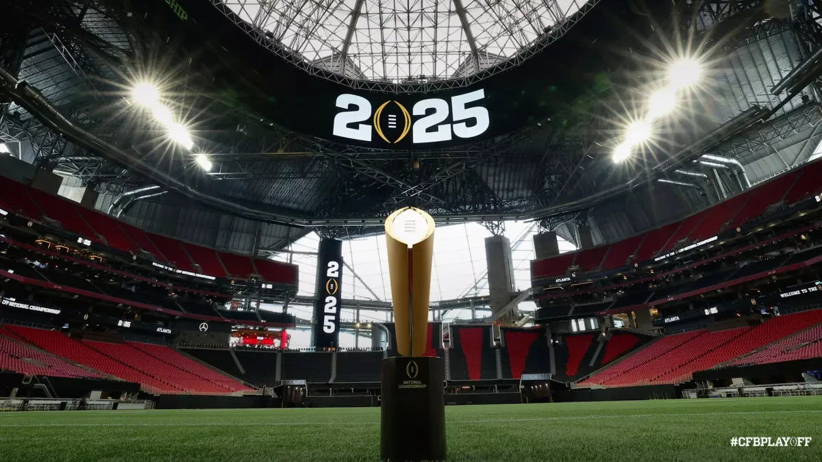 The College Football Playoff National Championship trophy on the field at Mercedes-Benz Stadium in Atlanta, Georgia.